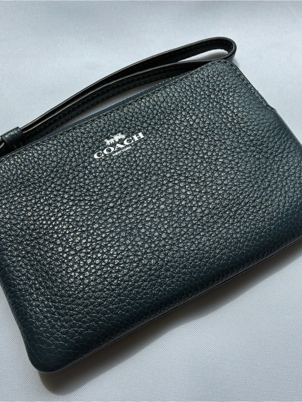 COACH PEBBLED LEATHER WRISTLET - NAVY